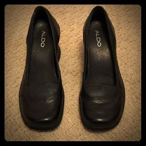Black loafers by Aldo
